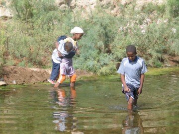 Kids fascinated by me washing, came over to have a look when we were camped near the palmeraie