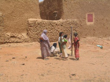 Moussa's family in Menaka, slaughtering a sheep