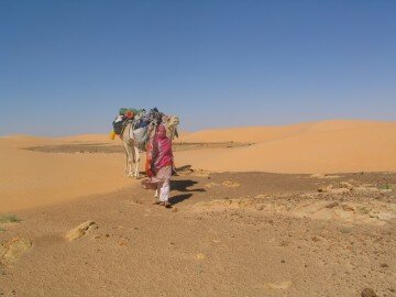 Walking through dunes with Khabuz, Mauritania